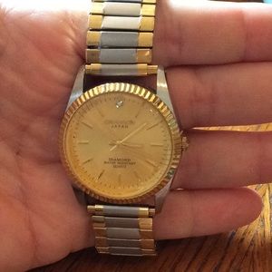 Men’s silver and gold water resistant watch